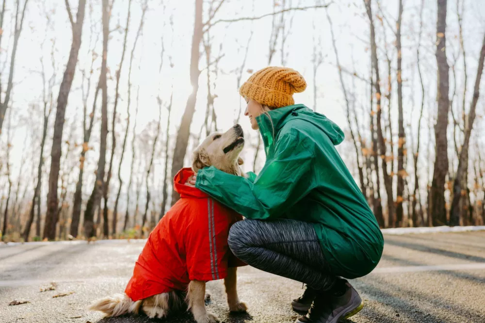 Girl with her dog in wilderness